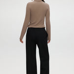 Black straight leg pull-on pants with elastic waistband, drawcord, and side pockets by Hilary Radley.
