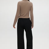 Black straight leg pull-on pants with elastic waistband, drawcord, and side pockets by Hilary Radley.