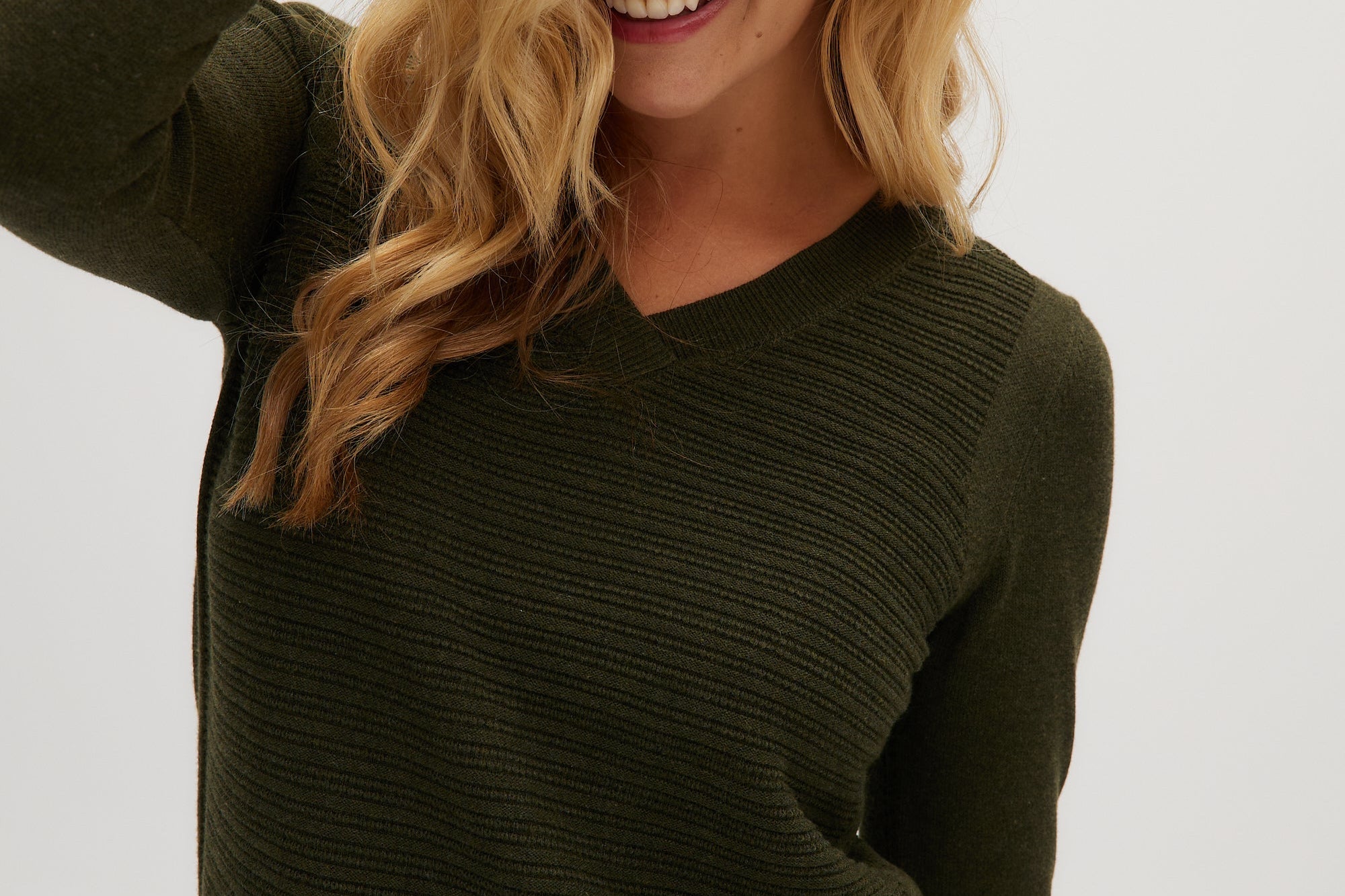Olive V-neck sweater close up