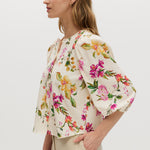 Cream Floral Linen Blend Blouse featuring puff sleeves and button-front closure by Hilary Radley.