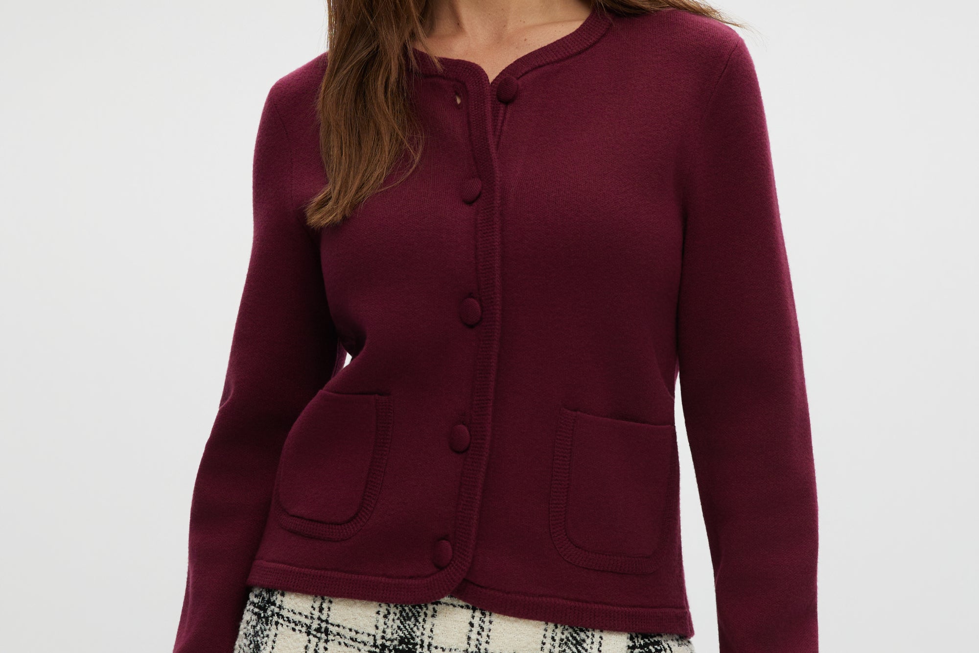 Burgundy knit cardigan with round collar and patch pockets