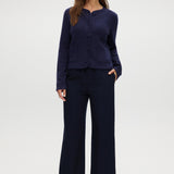 Navy Round Collar Knit Cardigan featuring long sleeves and front pockets by Hilary Radley.