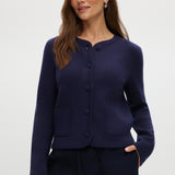 Navy knit cardigan with round collar, long sleeves, and front pockets.