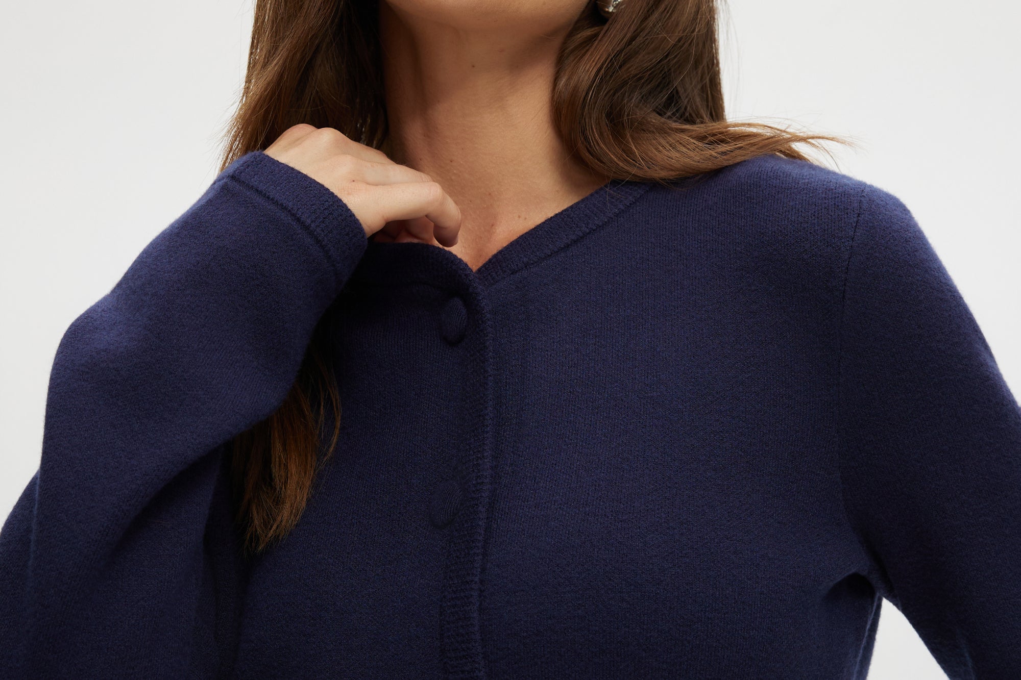 Navy Round Collar Knit Cardigan featuring long sleeves and front pockets, available from Hilary Radley.