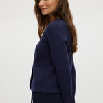 Navy Round Collar Knit Cardigan featuring long sleeves and front pockets by Hilary Radley.