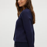 Navy Round Collar Knit Cardigan featuring long sleeves and front pockets by Hilary Radley.