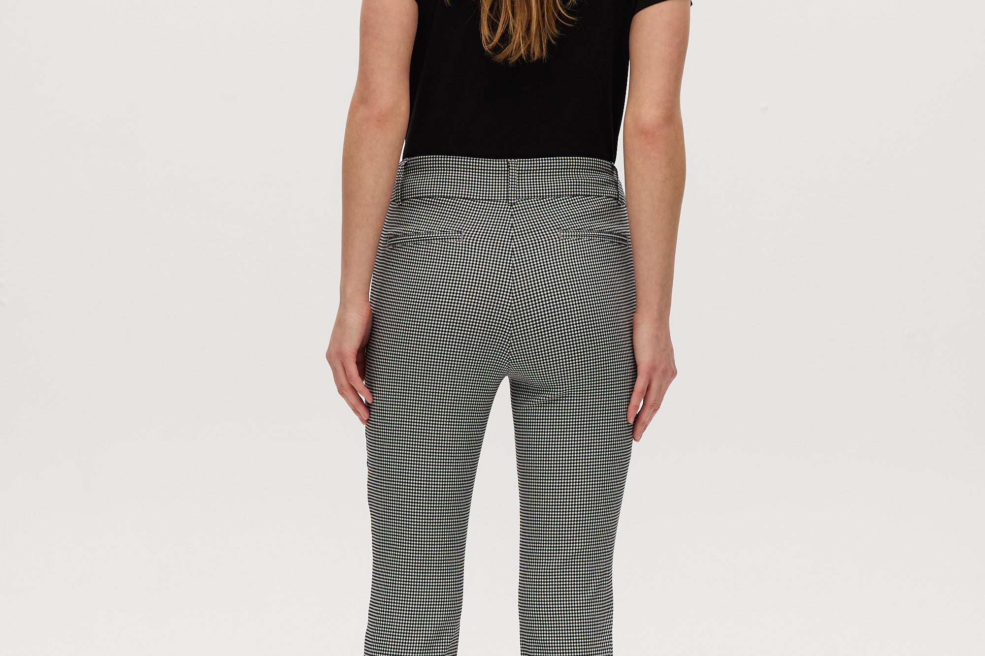 Black and off-white houndstooth super stretch pull-on capri with a cropped length by Hilary Radley.