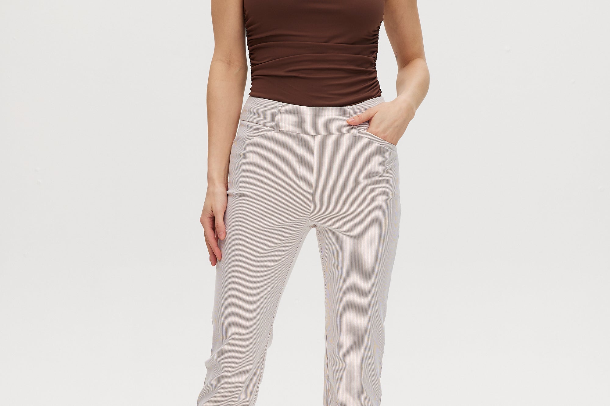 Camel striped super stretch pull-on capri with tummy control and functional pockets.