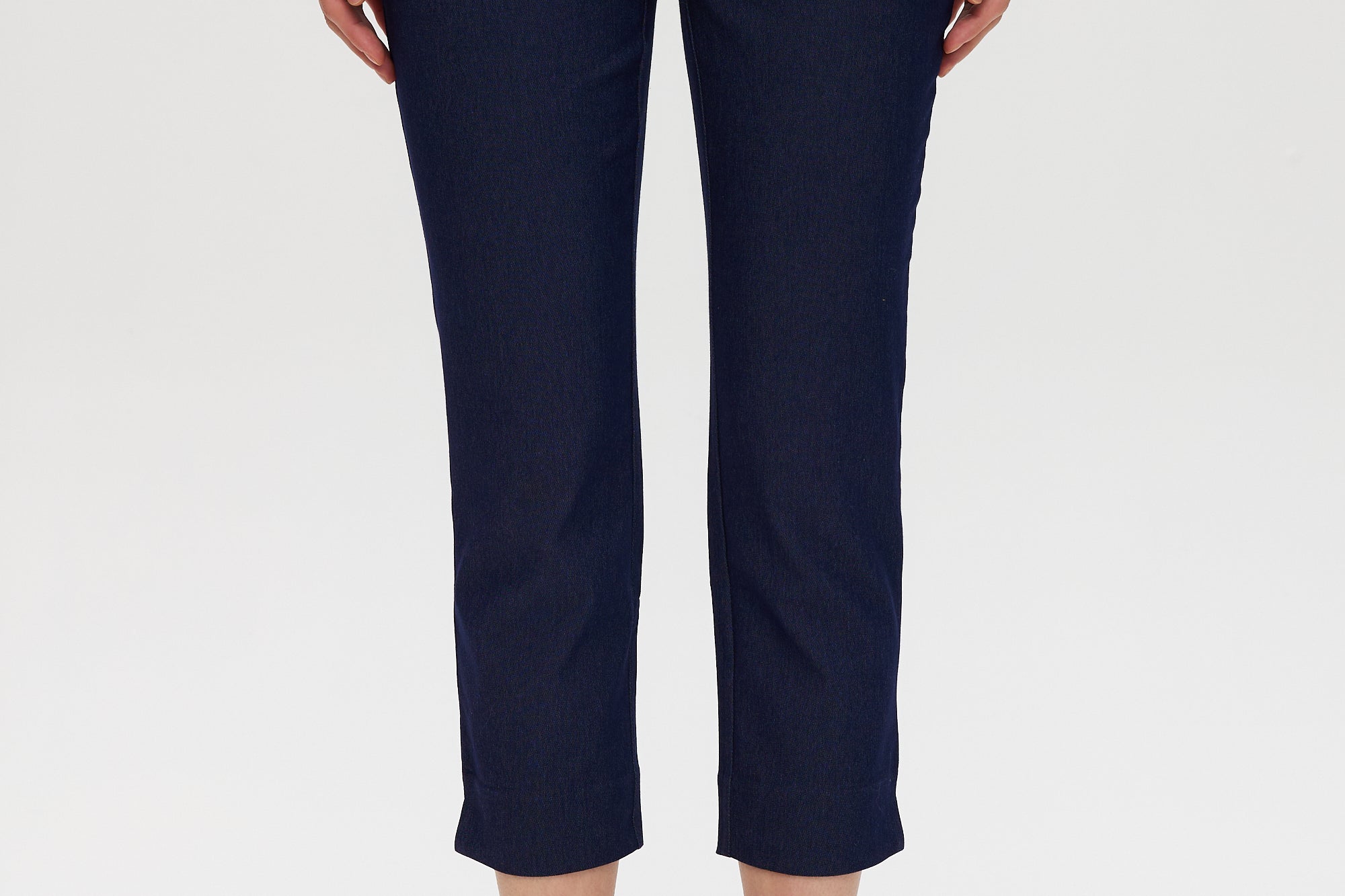 Navy Super Stretch Pull-On Capri pants featuring functional front pockets and faux back pockets by Hilary Radley.