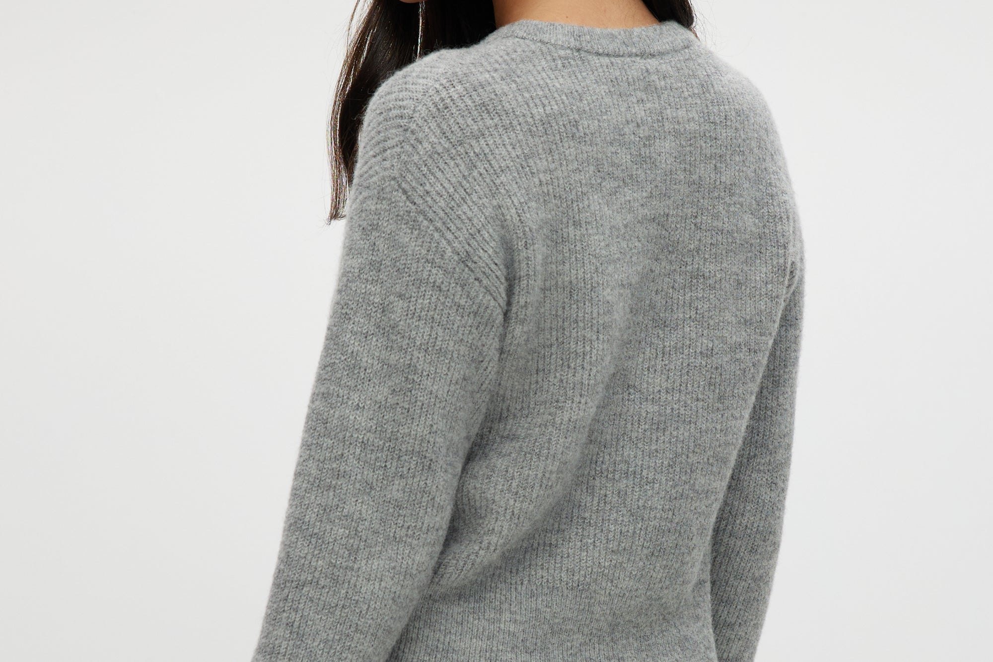 Grey shaker stitch crew neck cardigan with button-front design by Hilary Radley.