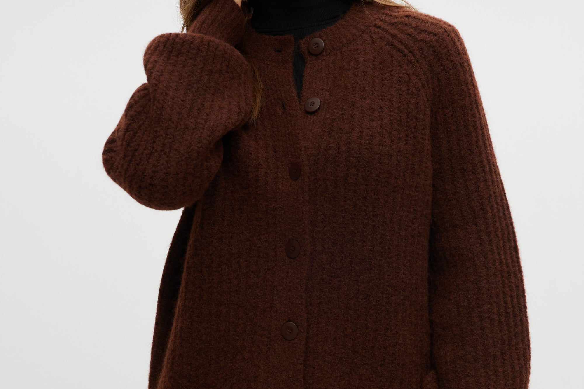 Coffee shaker stitch raglan cardigan with ribbed cuffs and hem.