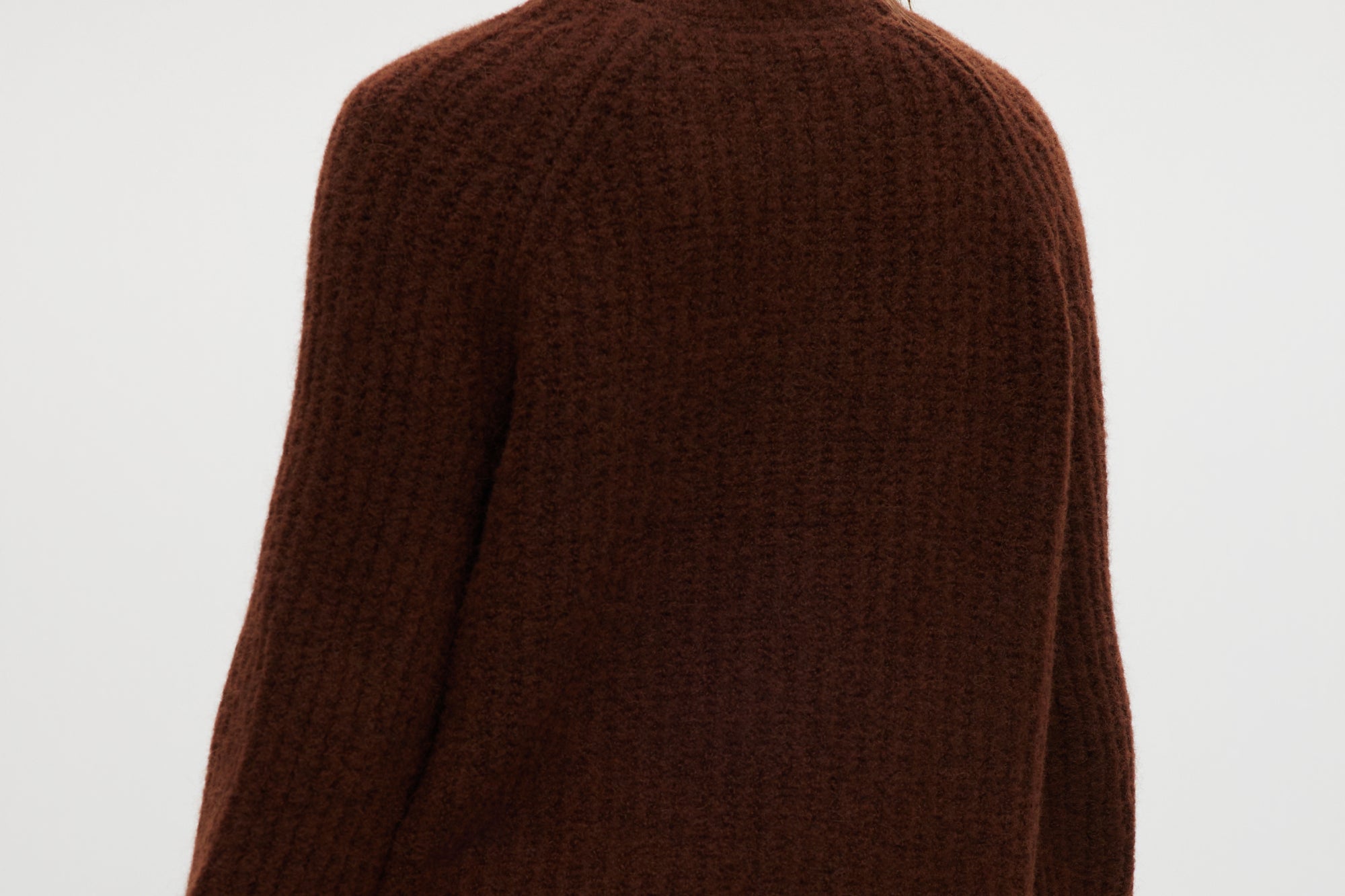 Coffee shaker stitch raglan cardigan featuring ribbed cuffs and hem by Hilary Radley.