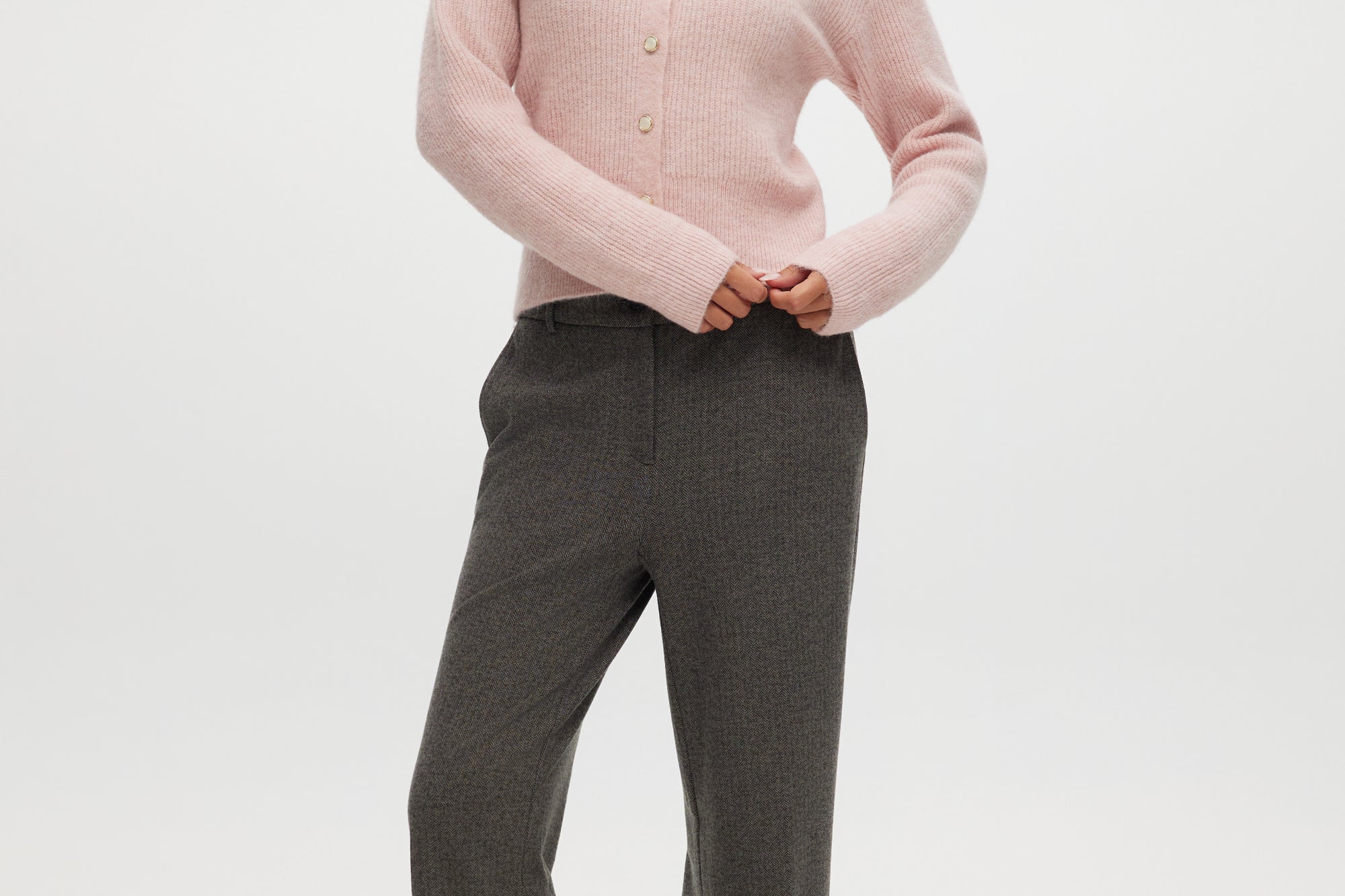 Pink Shaker Stitch Crew Neck Cardigan featuring a button-front closure, offered by Hilary Radley.