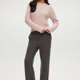 Pink Shaker Stitch Crew Neck Cardigan featuring a button-front closure, offered by Hilary Radley.