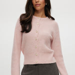Pink shaker stitch cardigan with crew neck and button-front closure.