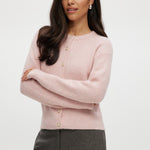 Pink shaker stitch crew neck cardigan featuring a button-front closure by Hilary Radley.