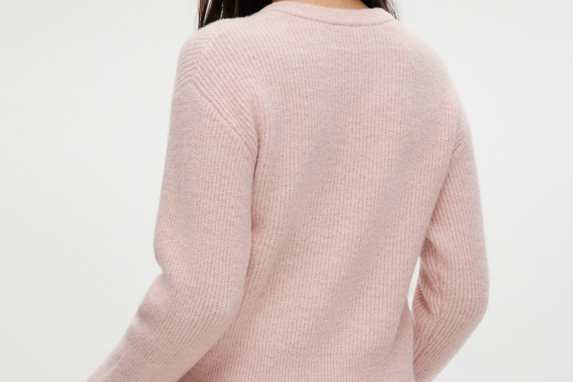 Pink shaker stitch crew neck cardigan featuring a button-front closure by Hilary Radley.