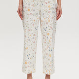 White High-Rise Floral Straight Leg Pant with button-front closure and pockets, sold by Hilary Radley.