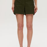 Olive high-rise stretch shorts featuring button closure, front patch pockets, and textured fabric by Hilary Radley.
