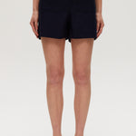 Navy high-rise stretch shorts featuring a structured waistband and functional pockets by Hilary Radley.