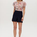 Navy high-rise stretch shorts with structured waistband and functional pockets.