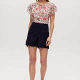 Navy high-rise stretch shorts with structured waistband and functional pockets.