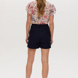 Navy high-rise stretch shorts featuring a structured waistband and functional pockets by Hilary Radley.