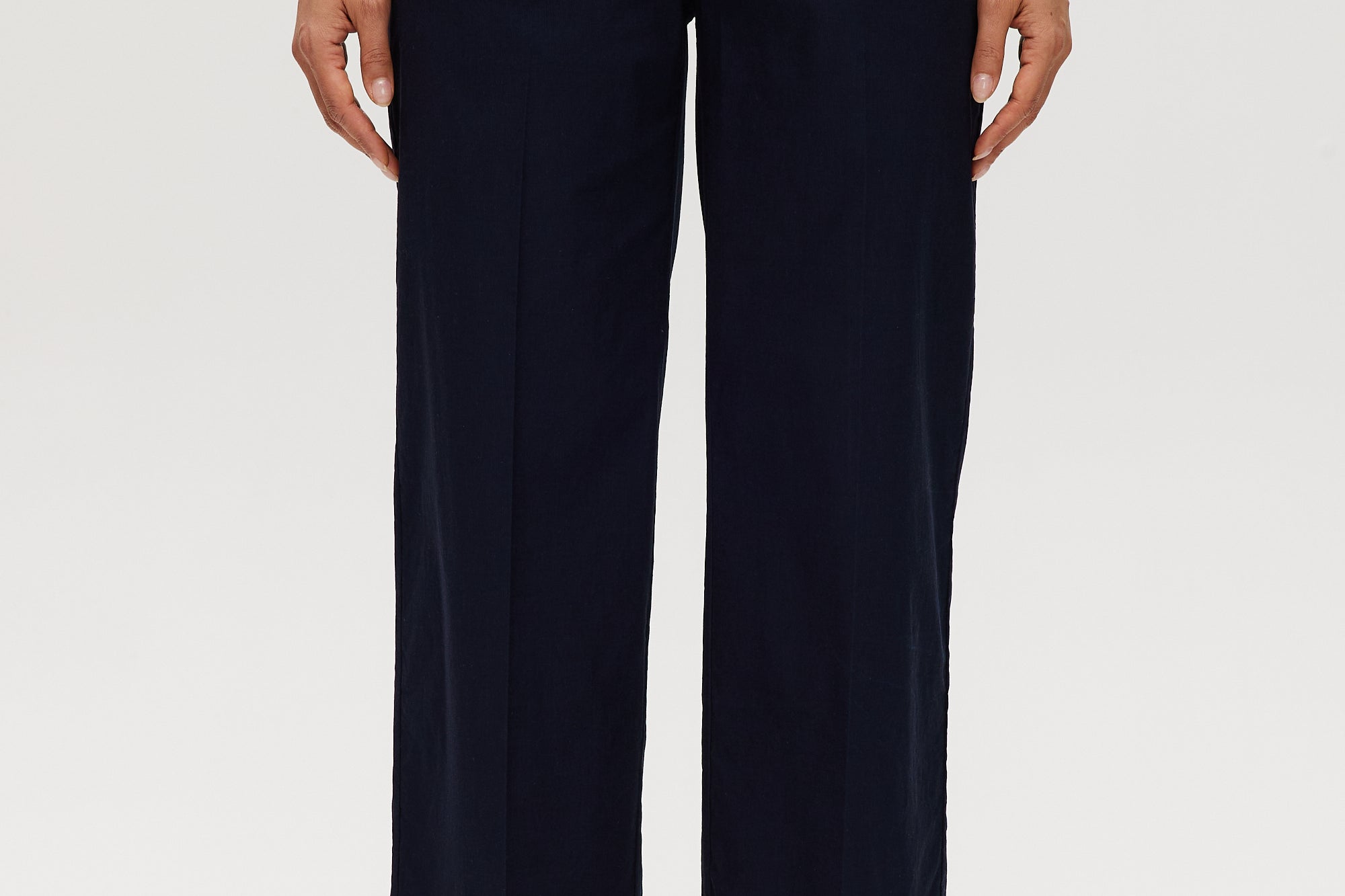 Navy high-rise straight leg pants featuring embroidery and front patch pockets by Hilary Radley.