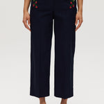 Navy high-rise straight leg pants featuring embroidery and front patch pockets by Hilary Radley.