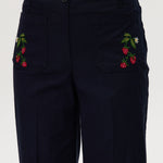 Navy high-rise straight leg pants featuring charming embroidery and front patch pockets by Hilary Radley.
