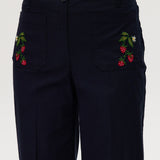Navy high-rise straight leg pants featuring charming embroidery and front patch pockets by Hilary Radley.