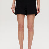 Black high-rise stretch shorts featuring button closure and front patch pockets by Hilary Radley.