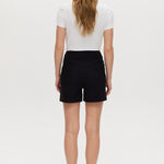 Black high-rise stretch shorts featuring button closure and front patch pockets by Hilary Radley.