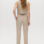 Beige checked slim leg pants featuring a button-front and pockets, part of a vest set by Hilary Radley.
