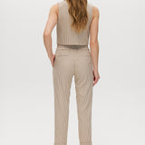 Beige checked slim leg pants featuring a button-front and pockets, part of a vest set by Hilary Radley.