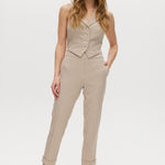Beige checked slim leg pants and vest set with button-front and pockets.