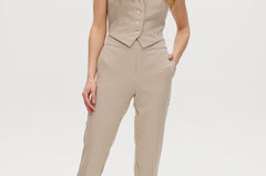Beige checked slim leg pants and vest set with button-front and pockets.