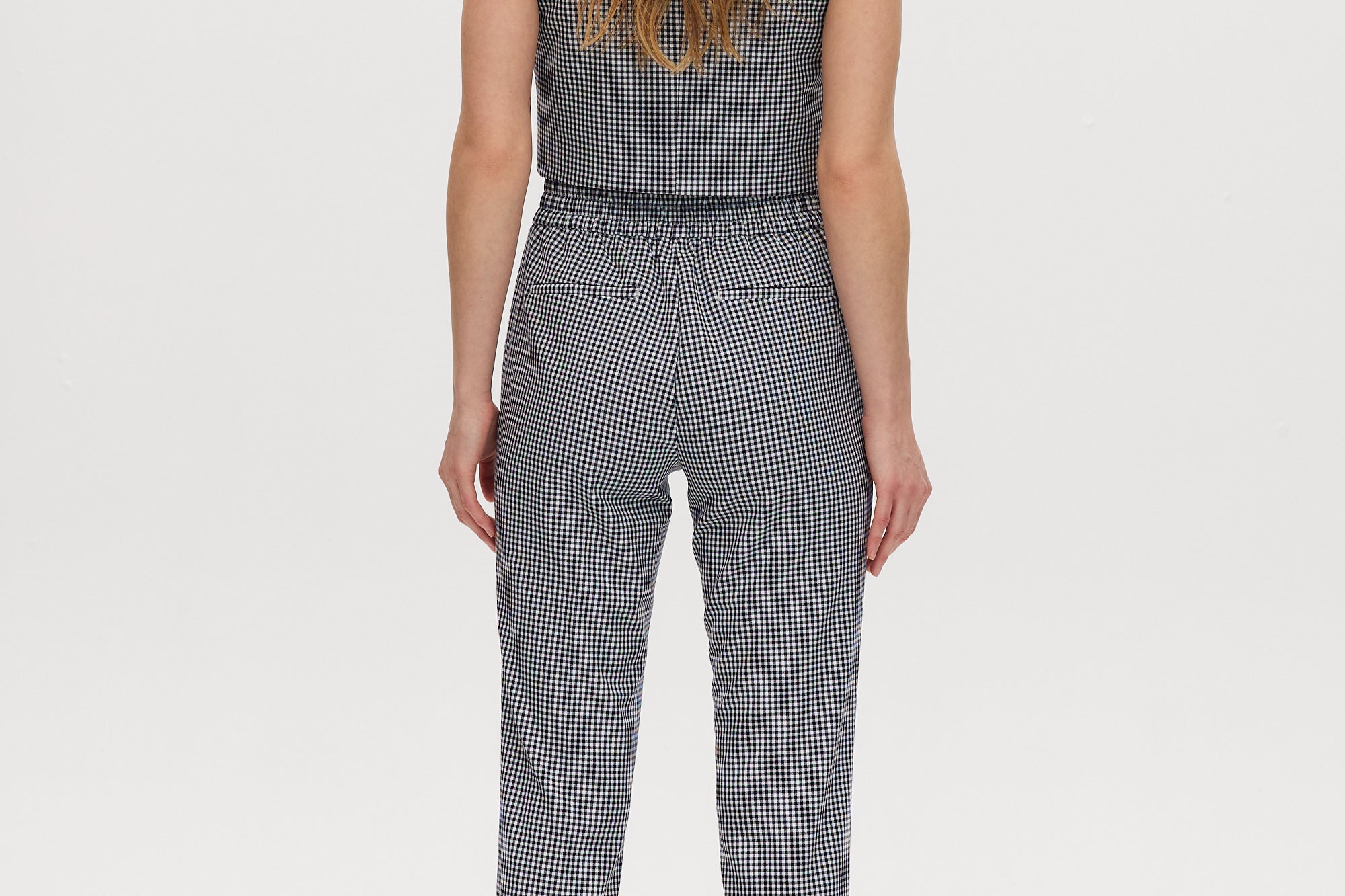 Navy checked slim leg pant and vest set featuring a pull-on waistband and button-front vest by Hilary Radley.