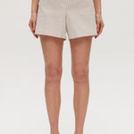 Beige striped pull-on shorts featuring decorative buttons and an elastic waistband by Hilary Radley.