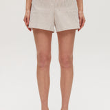 Beige striped pull-on shorts featuring decorative buttons and an elastic waistband by Hilary Radley.
