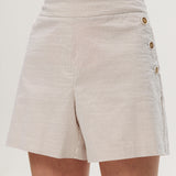 Beige striped pull-on shorts featuring decorative buttons and an elastic waistband by Hilary Radley.