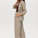 Beige yarn-dye linen stripe pull-on pants with elastic waistband, paired with a matching blazer by Hilary Radley.
