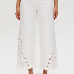 Off-White embroidered cotton straight leg pants featuring a pull-on waistband and intricate hem embroidery by Hilary Radley.