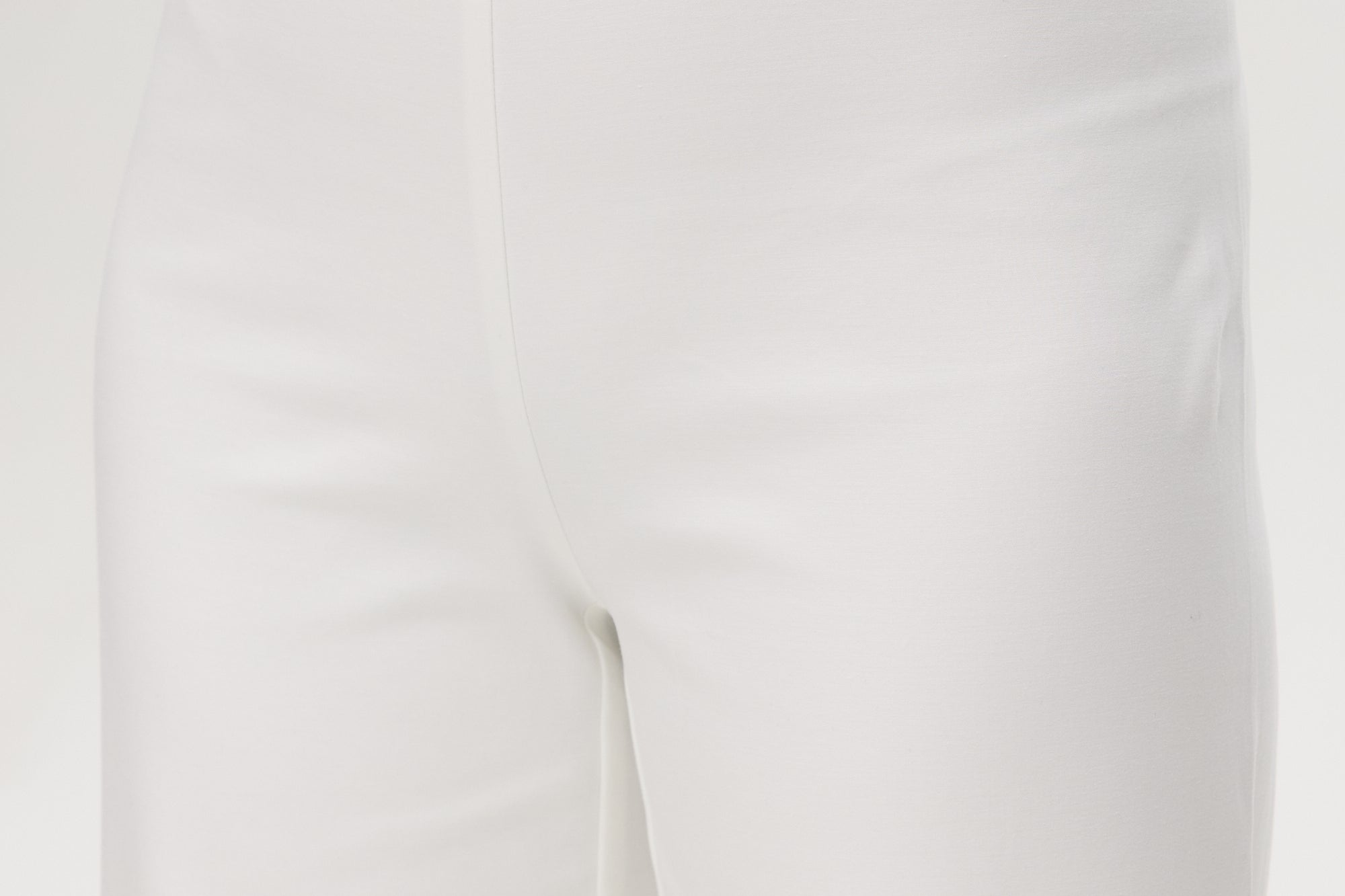 Off-White embroidered cotton straight leg pants featuring a pull-on waistband and hem embroidery by Hilary Radley.