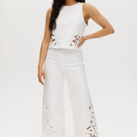 Off-White embroidered cotton straight leg pants with pull-on waistband and hem embroidery.