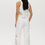 Off-White embroidered cotton straight leg pants featuring a pull-on waistband and intricate hem embroidery by Hilary Radley.
