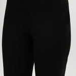 Black Skinny Leg Pull-On Pant featuring an elastic waistband and side pockets by Hilary Radley.