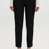 Black skinny leg pull-on pant featuring an elastic waistband and side pockets by Hilary Radley.