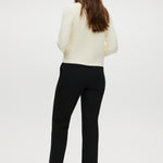 Black skinny leg pull-on pant featuring an elastic waistband and side pockets by Hilary Radley.