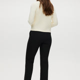 Black skinny leg pull-on pant featuring an elastic waistband and side pockets by Hilary Radley.